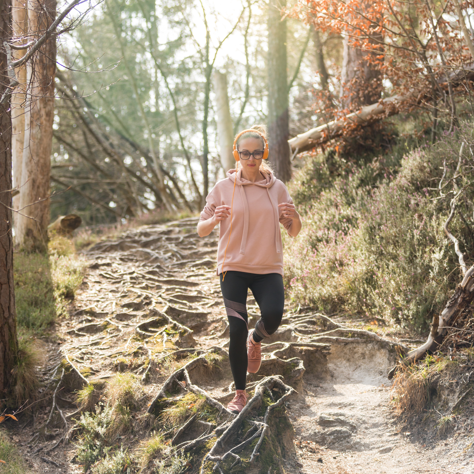 33576460_active-sporty-woman-listening-to-the-music-while-running-in-autumn-fall-forest-female-runner-training-outdoor-healthy-lifestyle-image-of-young-caucasian-woman-jogging-outside